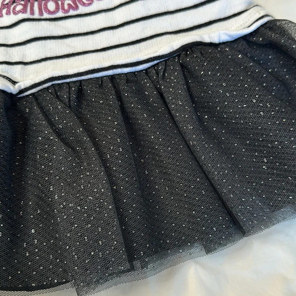 Bundle of my first Halloween clothes. Two long sleeve onesies and a tutu shirt.